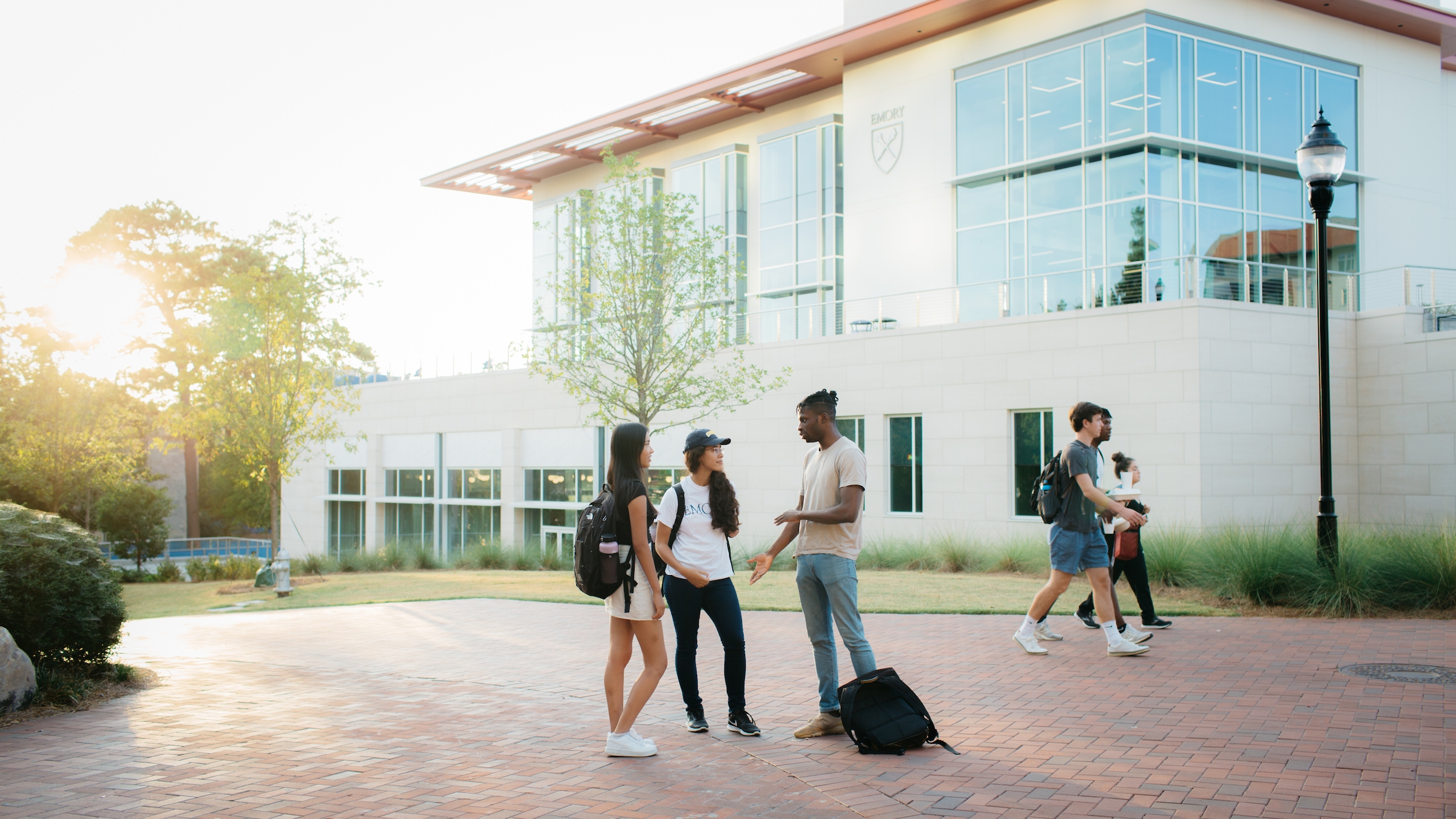 Student walking in front of student center. 